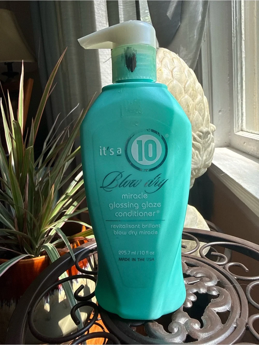 It's a 10 Miracle Glossing Glaze Conditioner — Teal Bottle